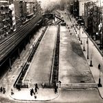 "Allen Street, looking north from Delancey, showing street widening. El at left, tenements on either side. January 1928."